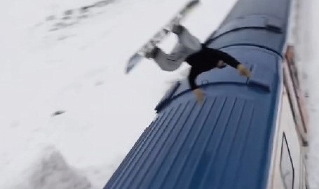 Snowboardla Doğu Ekspresi'nin üzerinden atladı