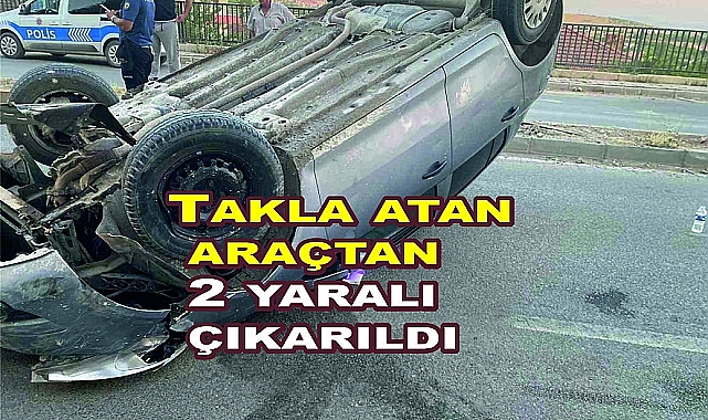 Takla atan araçtan 2 yaralı çıkarıldı