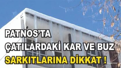 Patnos'ta çatılarda biriken kar kütleleri ve buz sarkıtlarına dikkat