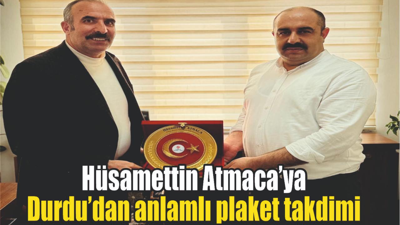 Hüsamettin Atmaca’ya Durdu’dan anlamlı plaket takdimi