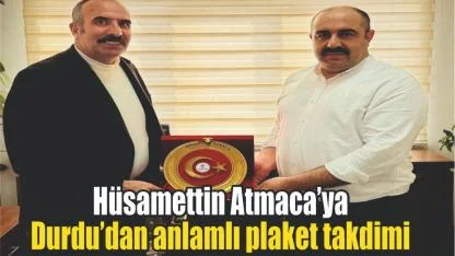 Hüsamettin Atmaca’ya Durdu’dan anlamlı plaket takdimi