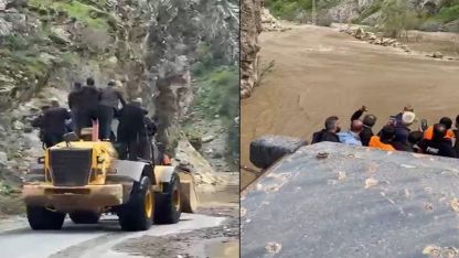 Dere taştı mahsur kalan işçiler kepçeyle taşındı